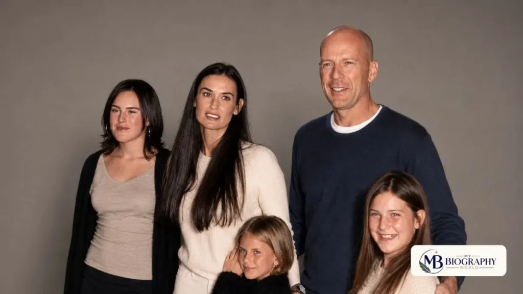 Bruce Willis and his family posing together for a group photo represented by My Biography World