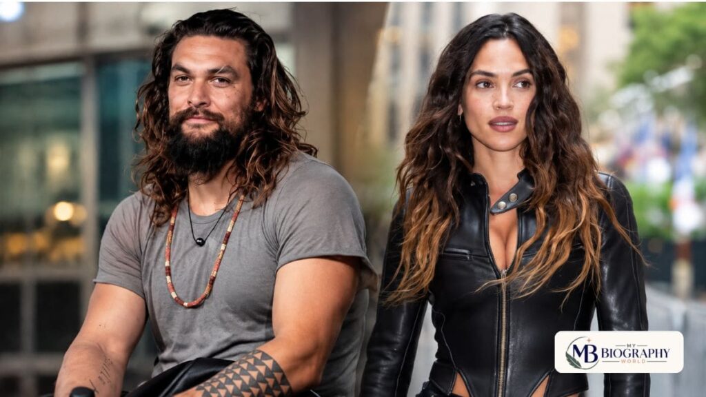 Adria Arjona and Jason Momoa together during a public appearance, featured in a celebrity biography article.