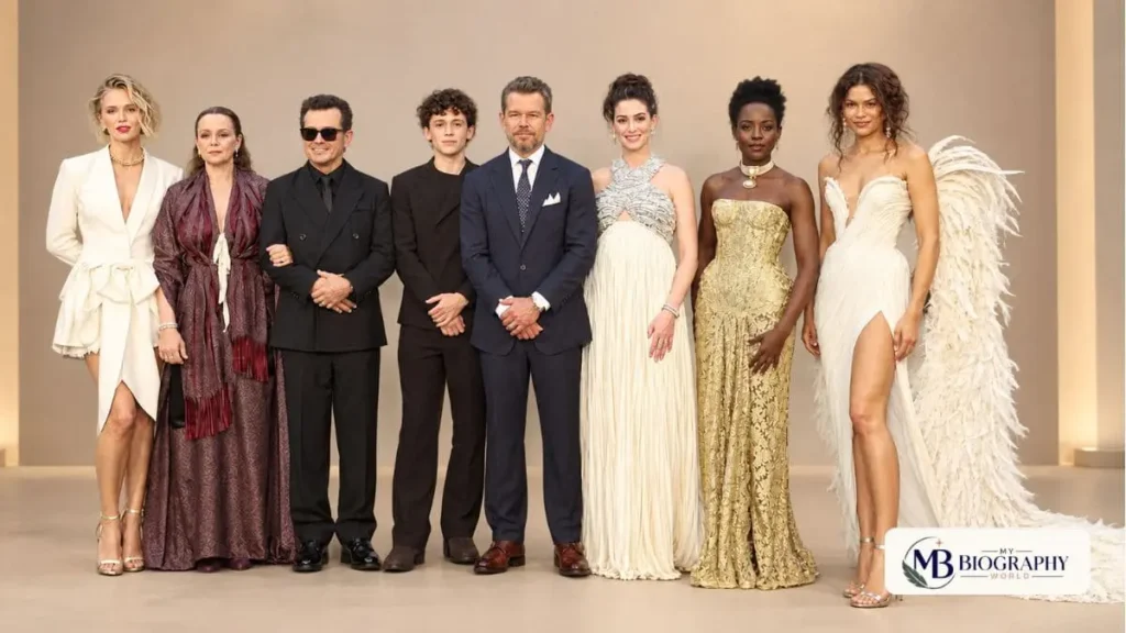 A group of The Odyssey Cast members posing together at a formal event, represented by My Biography World.